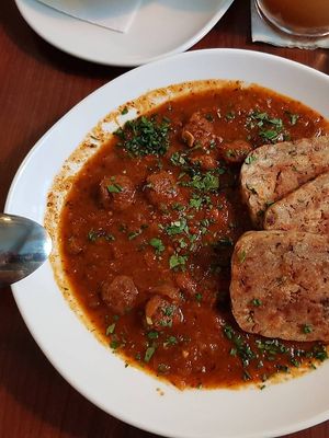 Wiener Saftgulasch mit Serviettenknödel at Velani in Vienna