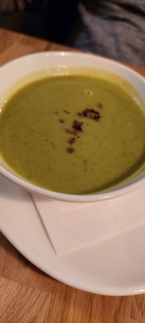 Erbsen Minz Suppe mit Speckwürfeln at Velani in Vienna