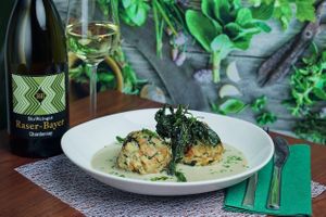 Wild garlic dumplings served with vegan cheese sauce. at Velani in Vienna