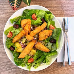 Fried chicken salad "styria style" with beans and pumpkin seed oil. Good to know: Our chicken is actually a mushroom, called "Chicken of the Woods". at Velani in Vienna