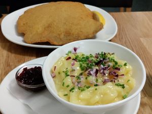 Traditional potato salad with lingonberry jam for the schnitzel at Velani in Vienna