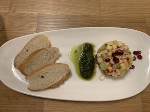 Apple-radish tartar with pesto and pomegranate  at Velani in Vienna