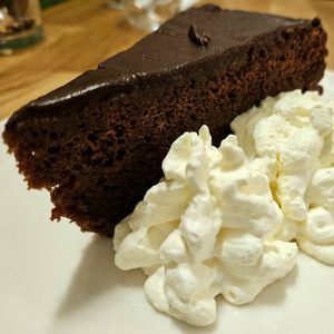 Sachertorte with whipped cream at Velani in Vienna