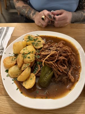 Seitan with onion roast and baked potatos  at Velani in Vienna