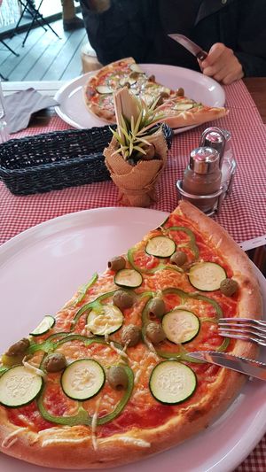 Vegan extra with vegan cheese, zucchini, olives and peppers at Pizzeria Napoli in Kamnik