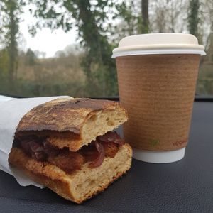 Vegan sausage and caramelised onion ciabatta and oat latte at Happyccino in Wimborne