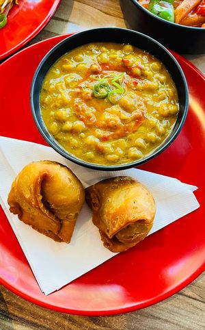 Samosa with blue peas curry  at Momo Central in Melbourne
