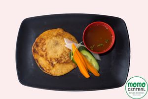 Black lentil pan cake with home made vegan sesame tomato chutney at Momo Central in Melbourne