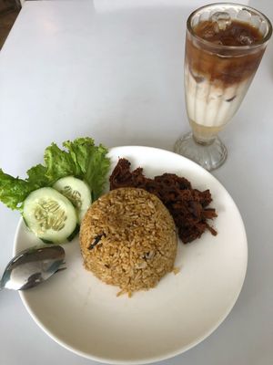 Curry fried rice and cafe latte at Loving Hut in Surabaya