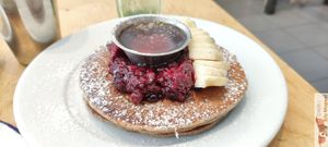 Vegan pancakes with red fruit jam and maple syrup at Kitchen Paris in Paris