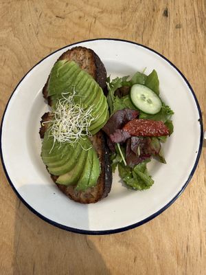 Avocado toast on sourdough breadd  at Kitchen Paris in Paris