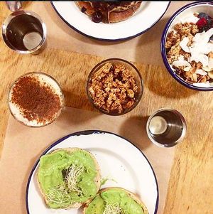 Chai latte, avocado toast, pancakes vegan and granola bowl for breakfast.  at Kitchen Paris in Paris