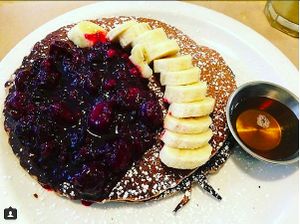 Vegan pancakes with fruits and mapple syrup at Kitchen Paris in Paris