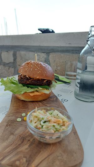 Biomania burger with a bit dry patty at BioMania Bistro Bol in Bol