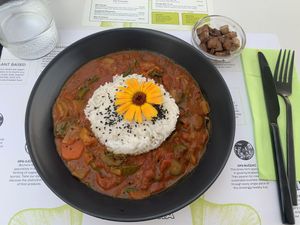 Red curry with side of smoked tofu  at BioMania Bistro Bol in Bol