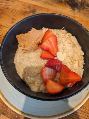 Porridge with soy milk, peanut butter, strawberries and almonds at Olive & Bean in Newcastle Upon Tyne