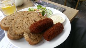 Dutch croquettes with vegan pulled meat ragout, served with brown bread, a salad and mustard mayo.  at Suikerkist in Breda