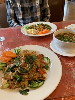 Drunken noodle, Tom yum soup, and vegan fried egg with spicy basil vegetables    at Aroy Thai Gardens in Middletown