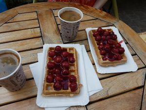 Black coffee, vegan waffles with hot cherries at Peters Waffelbar in Prerow