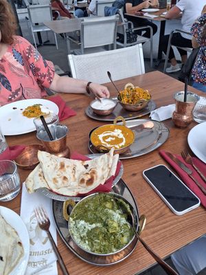 Aloo palak (bottom) mattar paneer, veg biryani (top) at Namaste in Ljubljana