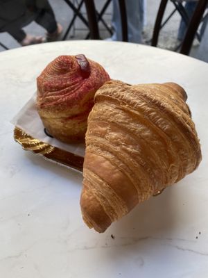 vegan croissant with strawberry flavour and a normal one   at Charlotte Croissanterie in Trieste