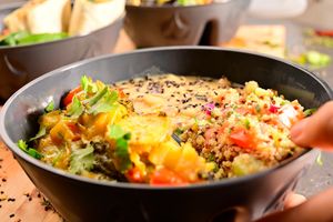 Baked broccoli with potatoes, quinoa pilaf, white beans in thyme sauce at Jídlo Baví in Prague