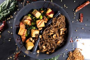Soba noodles with peanut sauce and smoked tofu, edamame beans, carrots and pak choi at Jídlo Baví in Prague