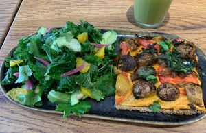 Pizza and salad  at Naya Studio in Paris