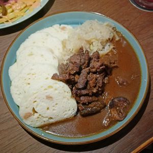 Výpěchy - slow roasted soy chucks served with gravy, sour cabbage & Czech bread dumplings at Shromaždiště in Prague