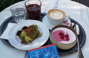 Avocado bread, whipped berry porridge, great cappuccino, berry smoothie at Karl Fazer Cafe in Helsinki