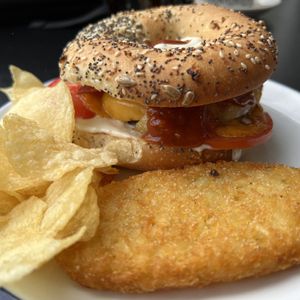 “Hangover Cure” Sausage Patty, Egg, Garlic & Onion Cream Cheese, Tomato, Cheddar, Aioli & BBQ Sauce with Bacon  at Sable in Richmond