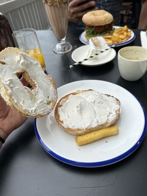 Everything bagel with vegan cream cheese! And one chip off hubs plate lol   at Sable in Richmond