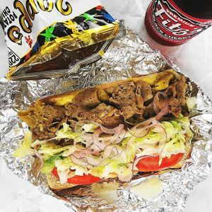Hot Italian Sub with roast beef, turkey, smoked ham, topped with lettuce, tomato, onion doused in vinegar oil dressing and available toasted or cold! Do eat! at Peace Love Coffee in St Charles