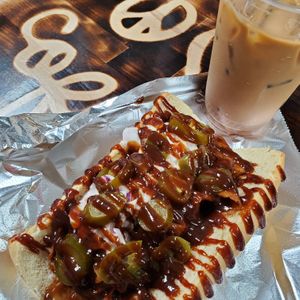 BBQ Chopped Beef Sammy - House made Roast Beef, sliced think, tossed in savory BBQ sauce, topped with creamy slaw, jalepenos and more sauce. This is oredered "extra sloppy"! at Peace Love Coffee in St Charles