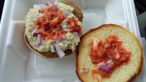 Baba falafel burger with onions and hot sauce. at Troy Grille in Kent