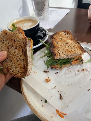 Sandwich vegano with hummus, tomato and rocket   at Los Picos Café in Valencia