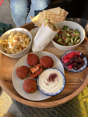 Ták share plate and half the eggplant wrap  at Charcoal and Chai in Como