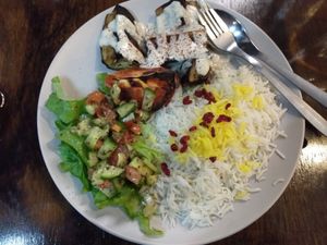 Grilled eggplant, grilled tomato, shirazi salad, saffron rice, tahini at Charcoal and Chai in Como