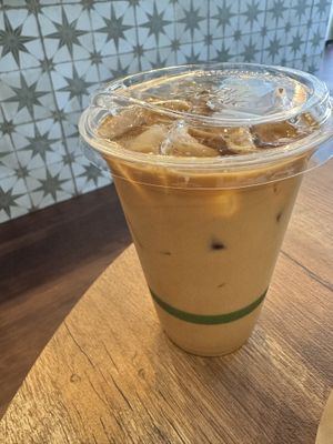 Pistachio oat milk iced latte   at Vegetation Plant Food in Lakeland