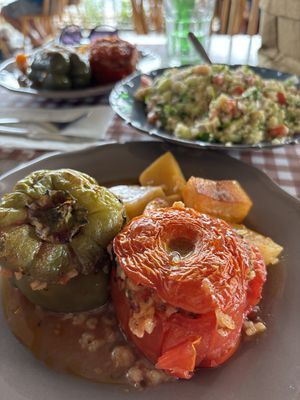 Gemista (stuffed peppers with tomatoes, rice, and herbs) with a tabule salad to share. Big portions.   at Palia Plaka - Παλιά Πλάκα in Kefalonia