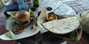 Vegan Burger, Hawaiian Bread with pineapple, tomatoes, beans, salad at Naked Flowers in Mondsee