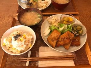 Sit-in meal with miso soup, brown rice with corn and sesame, salad, Japanese pickles, and plant-based katsu. at Nishimaki Gohan in Tokyo