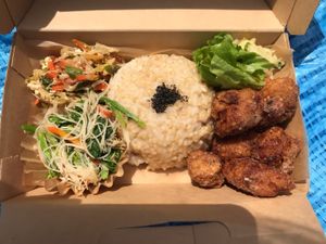 Vegan take out bento with brown rice, salad, plant-based fried nuggets, and veggies! at Nishimaki Gohan in Tokyo