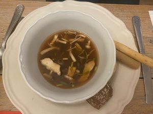 From the take away christmas menu: Mushroom bouillon with kombu and tamari. Served with bread and sticks. at The Green Room - Cityhotel Wood in Middelburg