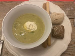 From the take away christmas menu: Creamy leek soup with horseradishcreme and bay leaf oil. Served with bread and sticks. at The Green Room - Cityhotel Wood in Middelburg