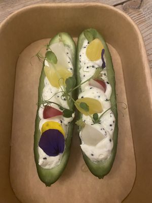 From the take away christmas menu: Filled mini cucumbers with a creamy filling and pickled radishes. at The Green Room - Cityhotel Wood in Middelburg
