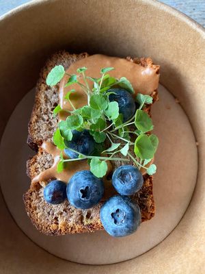 Banana bread with walnuts, blueberries, a chocolate frosting and anise cress. at The Green Room - Cityhotel Wood in Middelburg
