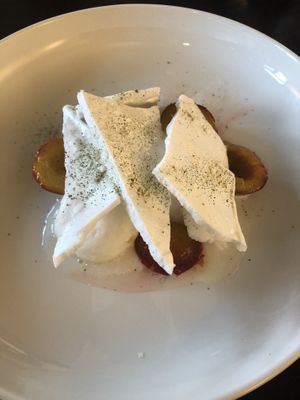 Baked prunes with lemon sorbet and meringue made from aquafaba. at The Green Room - Cityhotel Wood in Middelburg