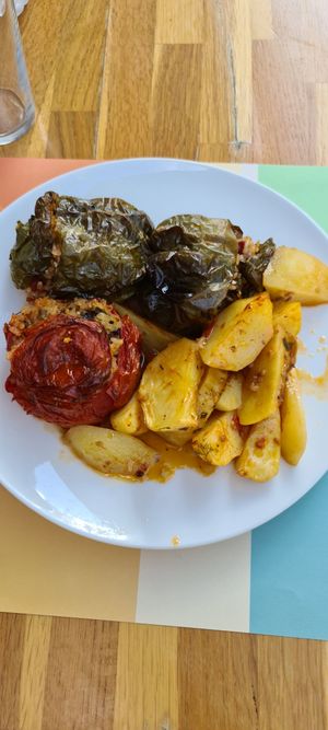 3 stuffed peppers and potatoes. All cold. at Macoo Eatery in Crete