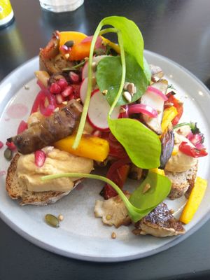 Shiitake toast with miso hummus, Jerusalem artichoke, pomegranate and a few pieces of shiitake mushroom at Circus Restaurant in Antwerpen